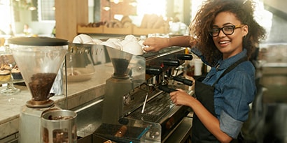 skilled barista making fresh coffee using water filtration system